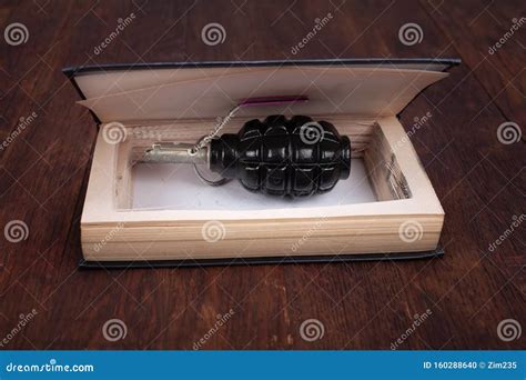 Hand Grenade Hidden in a Book Stock Photo - Image of fire, ammunition: 160288640