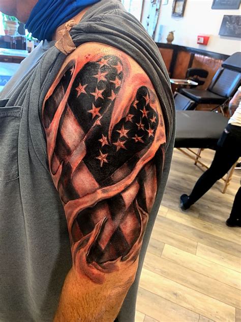 American flag skin rip tattoo by Jordyn Grine Tattoo dons at EvolvedBodyArt in Columbus Ohio ...