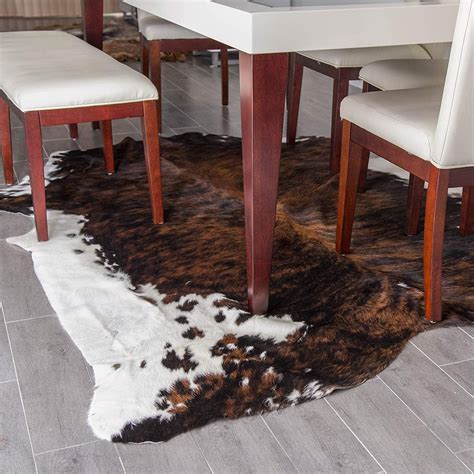 12 Best Cowhide Rug Ideas from Real, Tricolor, and Fake Cowhides [PHOTOS]