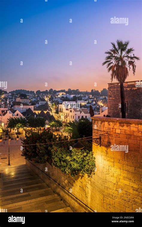 Alberobello, Italy with Trulli houses at dusk Stock Photo - Alamy