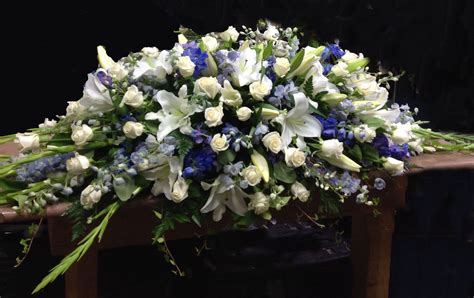 Blue & white casket spray. #sympathyflowers #floraltribute F04 | Funeral flower arrangements ...