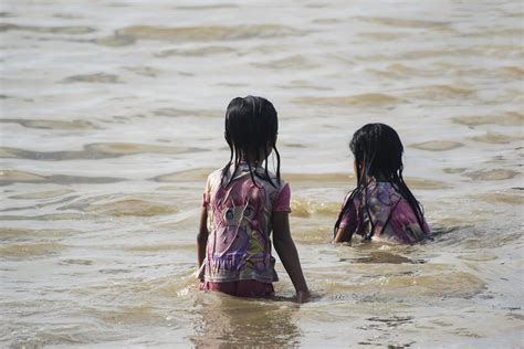 Sorong, Indonesia 2021- People on the beach 3390576 Stock Photo at Vecteezy