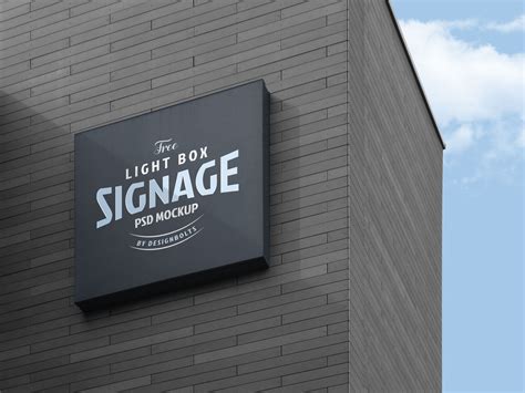 Free Wall Mounted Company Logo Signage Board on Building Mockup PSD - Designbolts