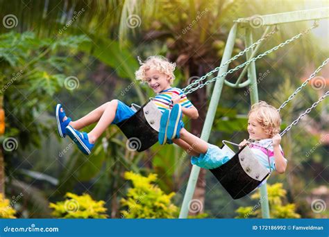 Child on Playground. Swing Kids Play Outdoor Stock Photo - Image of outdoors, funny: 172186992