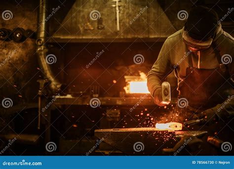 The Blacksmith Forging the Molten Metal on the Anvil in Smithy Stock Photo - Image of mature ...