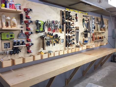 Tool rack and floating workbench for a high school woodshop. | Workbench plans diy, Tool rack ...