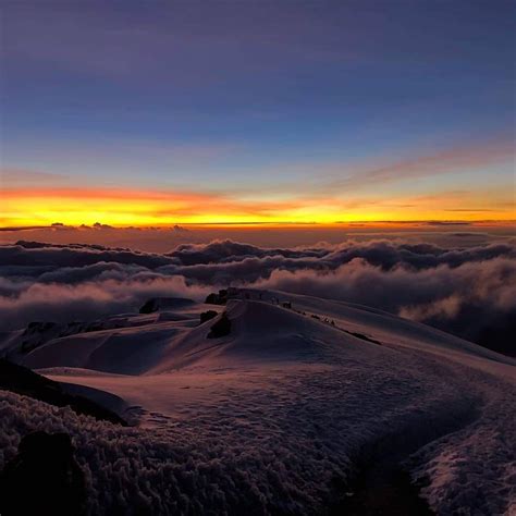 Sunrise on Mt Kilimanjaro in Tanzania, Africa. Looking behind us back ...