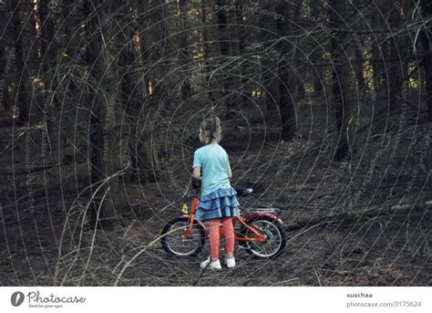 girl alone in the forest - a Royalty Free Stock Photo from Photocase