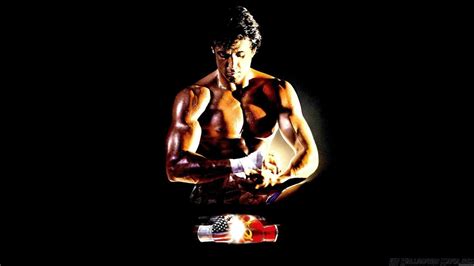 Download Rocky Balboa Holding Boxing Gloves Wallpaper | Wallpapers.com