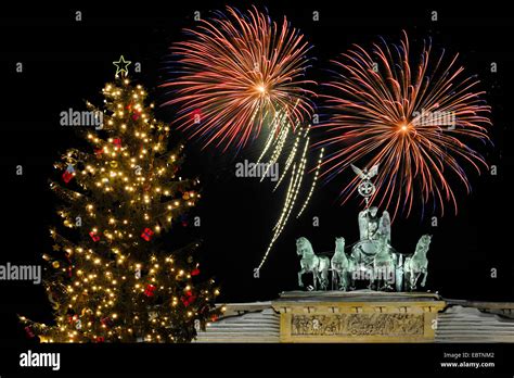 Quadriga on Brandenburg Gate, with christmas tree and fireworks, Germany, Berlin Stock Photo - Alamy