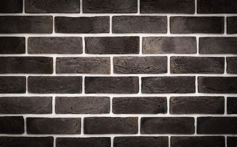 Dark brown brick wall, creative back-phonon, closeup | Free Photo