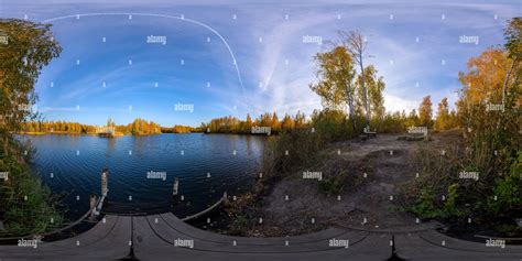 360° view of seamless full spherical 360 by 180 degrees panorama of evening autumnal lake with ...