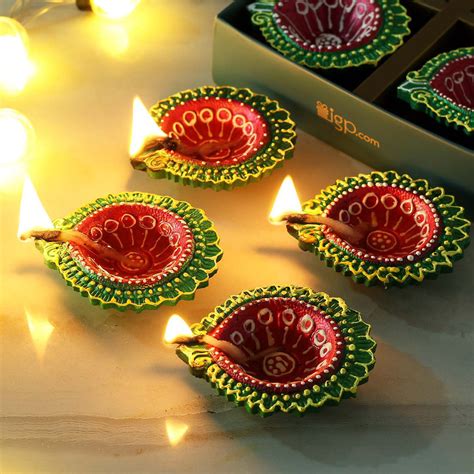 Buy/Send Multi Colored Hand Painted Clay Diya Set of 4 Online | IGP ...