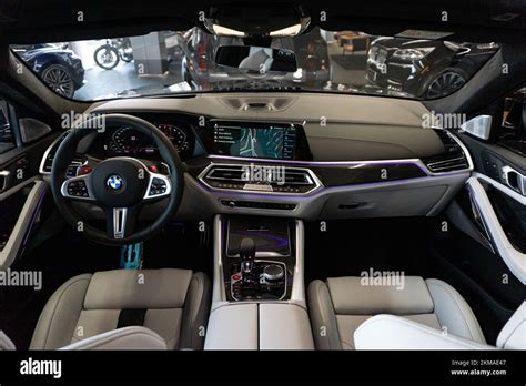 The cockpit of the BMW X6 M Competition car with a white leather ...