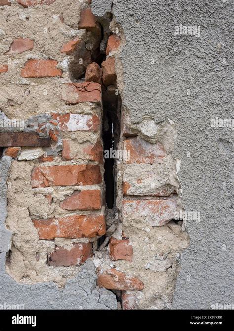 Old and cracked brick wall background closeup Stock Photo - Alamy