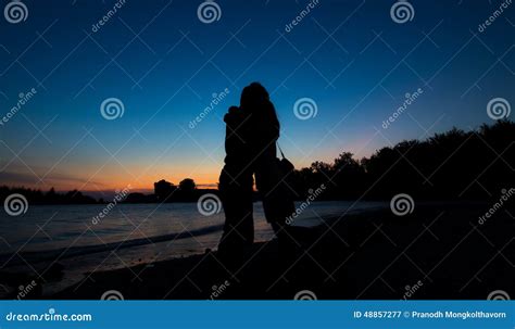 Silhouette of Couple Hug on the Beach after Sunset Stock Image - Image ...