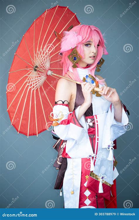 Female Cosplayer in a Pink Anime Costume Wearing Pink Hair Stock Image ...