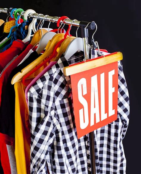 Sale in a Clothing Store - Discount Sign at a Clothes Rack. Stock Image - Image of banner, hang ...