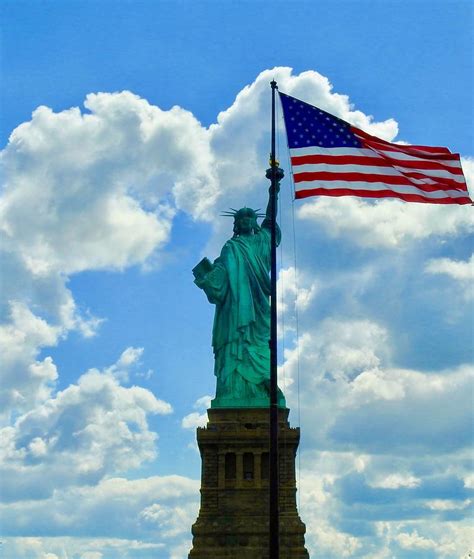 Statue of Liberty holding American Flag Photograph by Kenneth Summers - Pixels