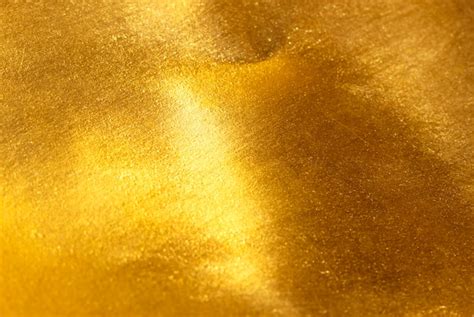 Premium Photo | Shiny yellow leaf gold foil texture