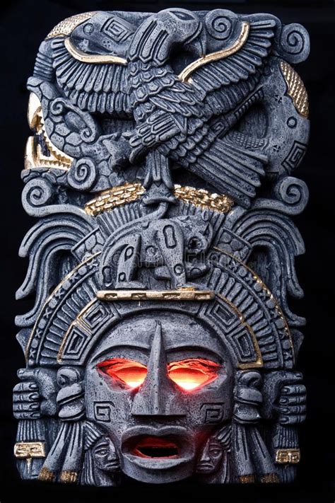 The god is angry. Aztec / Mayan god idol with glowing red eyes on a ...