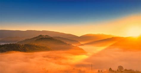 Premium Photo | Autumn morning mountain landscape sunrise over the fog