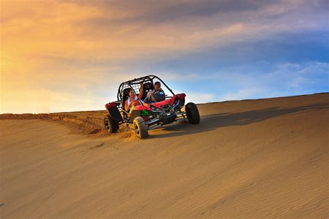 Person Riding Dune Buggy on Desert · Free Stock Photo