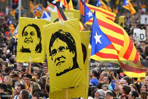 Protesters wave flags in the street as a general strike is called ...