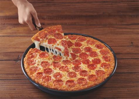 What does Pizza Hut put on their crust?