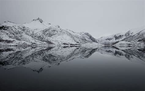 black and white mountain filled with snow near lak MacBook Air Wallpaper Download | AllMacWallpaper