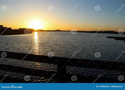 Sunset at Bolsa Chica Wetlands through a Wooden Bridge Stock Photo ...