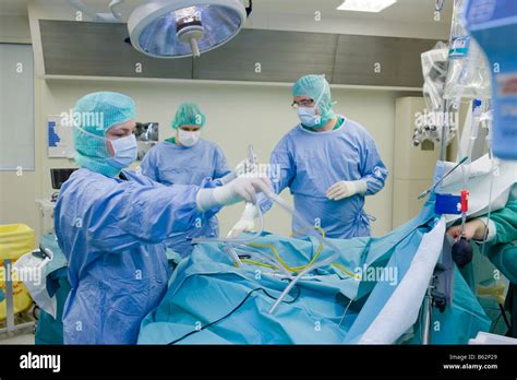 Neurosurgeon during surgery to remove a benign brain tumor, Reykjavik ...