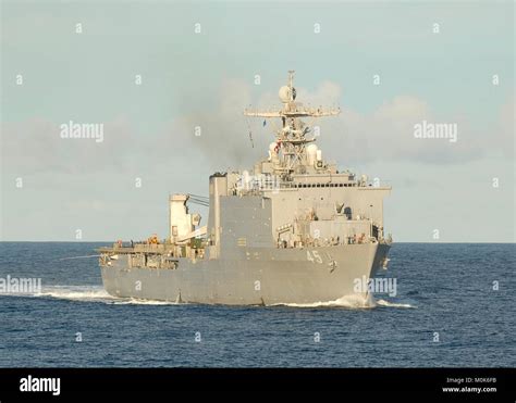 The U.S. Navy Whidbey Island-class amphibious dock landing ship USS Comstock steams underway ...