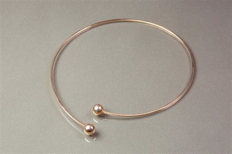 Premium Photo | A gold bracelet with a pearl and a pearl bracelet.