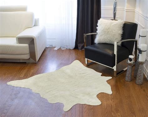 12 Cowhide Rug Ideas - Real, Tricolor, and Fake Cowhides [PHOTOS]