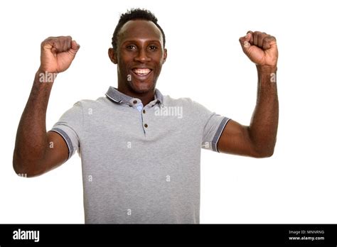 Young happy black African man smiling and looking excited Stock Photo - Alamy