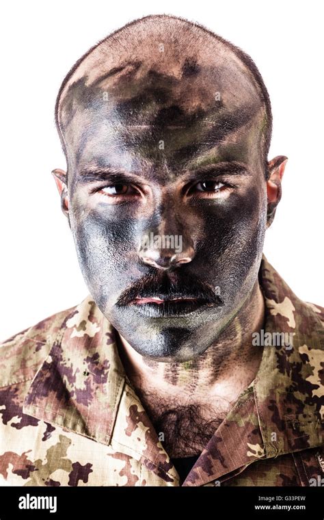 a soldier wearing camouflage clothing and army face paint isolated over a white background Stock ...