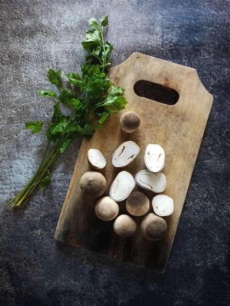 Fresh Mushroom and Coriander Leaves on Cutting Board Stock Photo - Image of vegetable ...