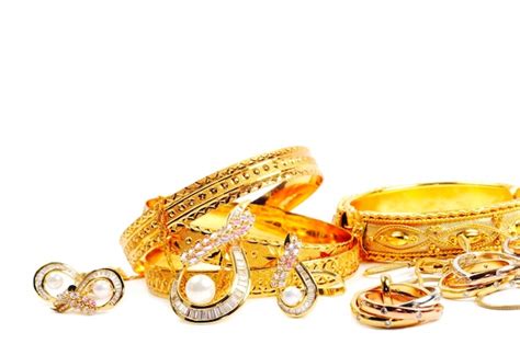 Premium Photo | Golden precious jewelry isolated on white background