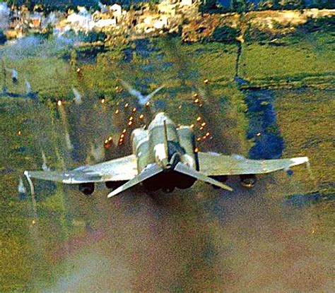 A USAF F-4 Phantom unleashes its fury on the enemy during the Vietnam war. | Vietnam, Military ...