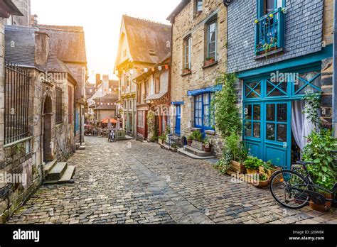 Panoramic view of a charming street scene in an old town in Europe in beautiful evening light at ...