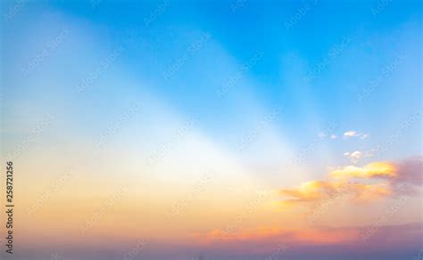 beautiful blue sunset sky with white clouds background, Nature background, yellow and orange ...