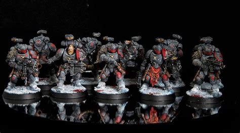 the warhammers are all lined up in formation on a black surface with reflections