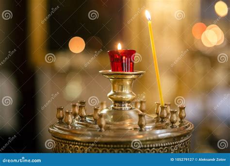 Burning candles in church stock image. Image of light - 105279127