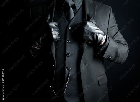 Foto de Portrait of Mysterious Man in Black Suit and Gloves. Concept of Mafia Hitman or Hotel ...