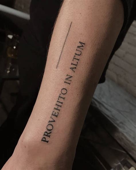 A Latin phrase ‘Provehito in Altum’ meaning ‘You will move forward into heights’ tattoo on the ...