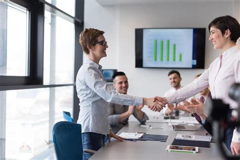 business womans handshake 12435903 Stock Photo at Vecteezy