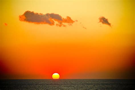 Sunset In Orange Color Photograph by Raimond Klavins - Pixels