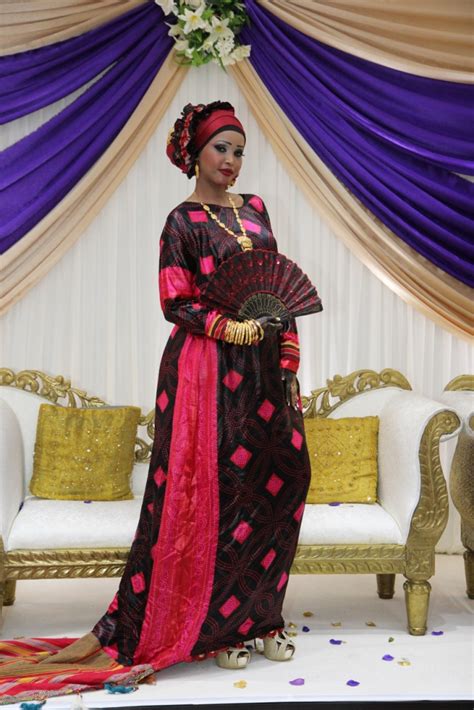 a Somali bride posing for the photographer and videographer on her ...