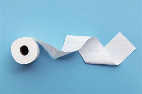 A Single Roll of Toilet Paper Unrolled on a Blue Background Stock Image - Image of recycle ...